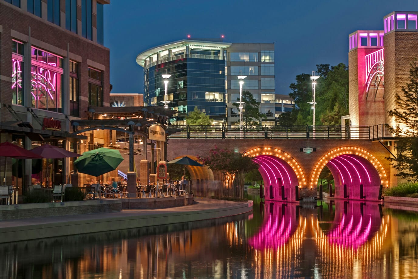 Waterways Illuminated with Pink Neon at The Woodlands