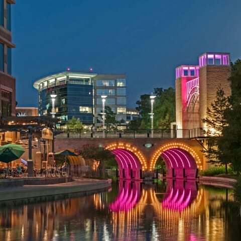Image features the Waterway in The Woodlands. Home to 49 Fortune 500 company headquarters, Texas attracts the best and brightest.
